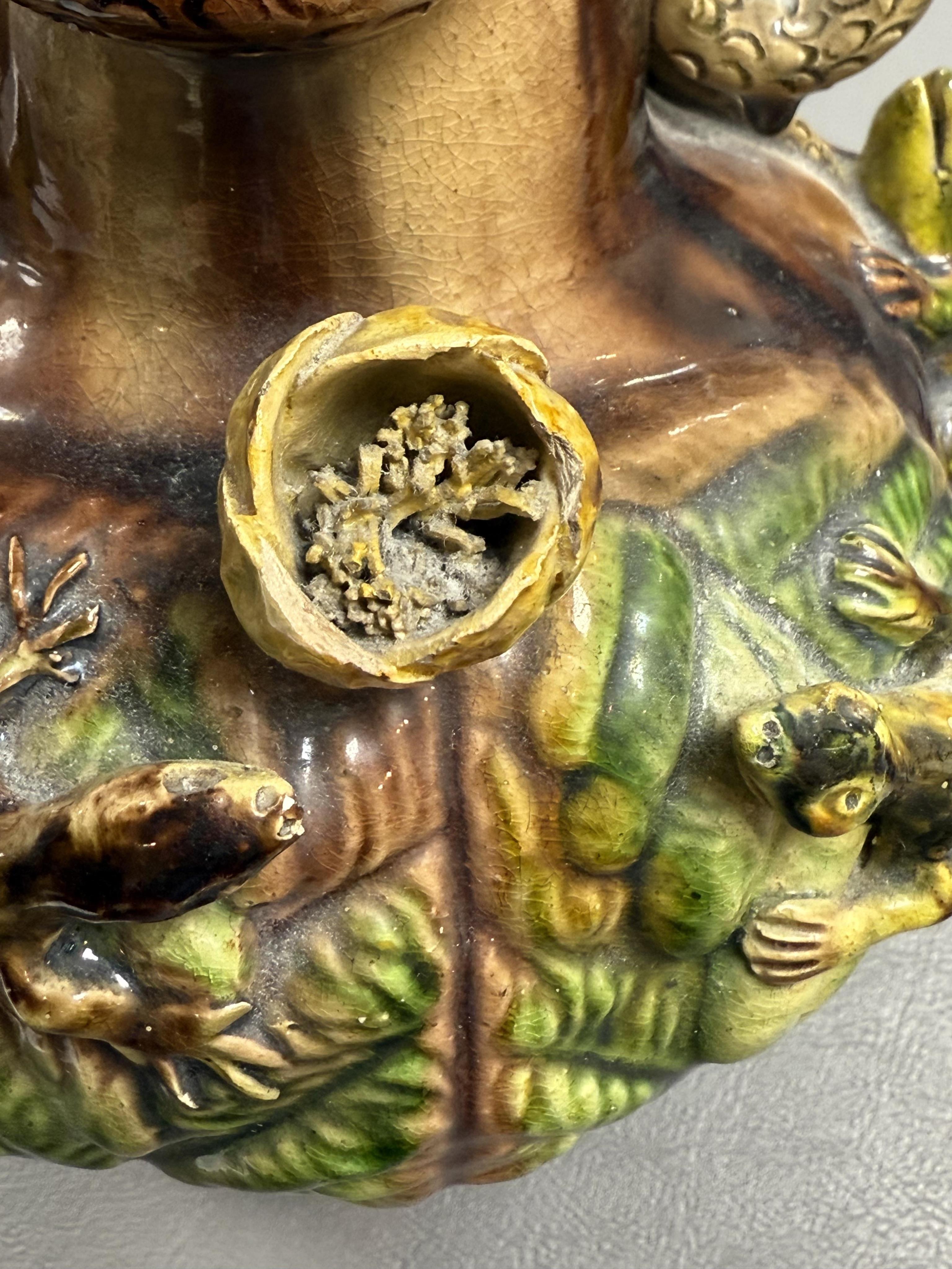 A pair of Palissy ware two handled vases, by Mafra Caldas Da Rainha, late 19th century